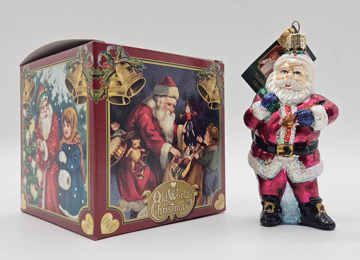Old World Christmas Jolly Old Elf ornament #40282 – ornament alongside photographed packaging