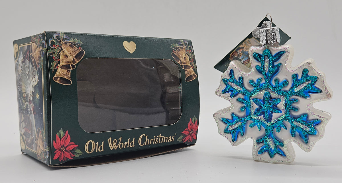 Old World Christmas Snowflake – Version 01 ornament #36076 – ornament alongside photographed packaging