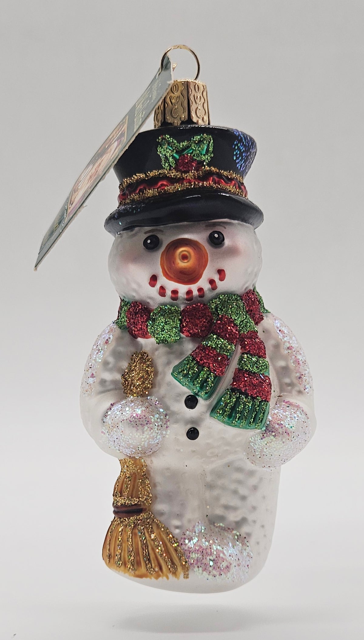 Old World Christmas Snowman with Broom ornament #24013 – front ornament view