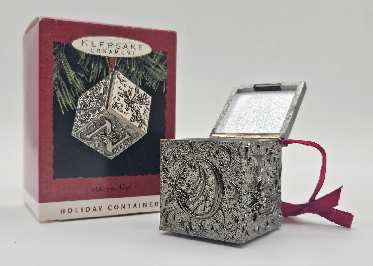 1993 Silvery Noel QX5305 — ornament opened beside box