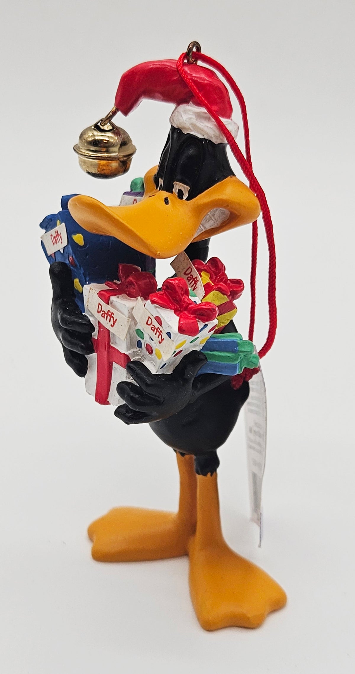 Midwest – “Midwest of Cannon Falls Daffy Duck Hugging Presents” – Damaged — ornament view