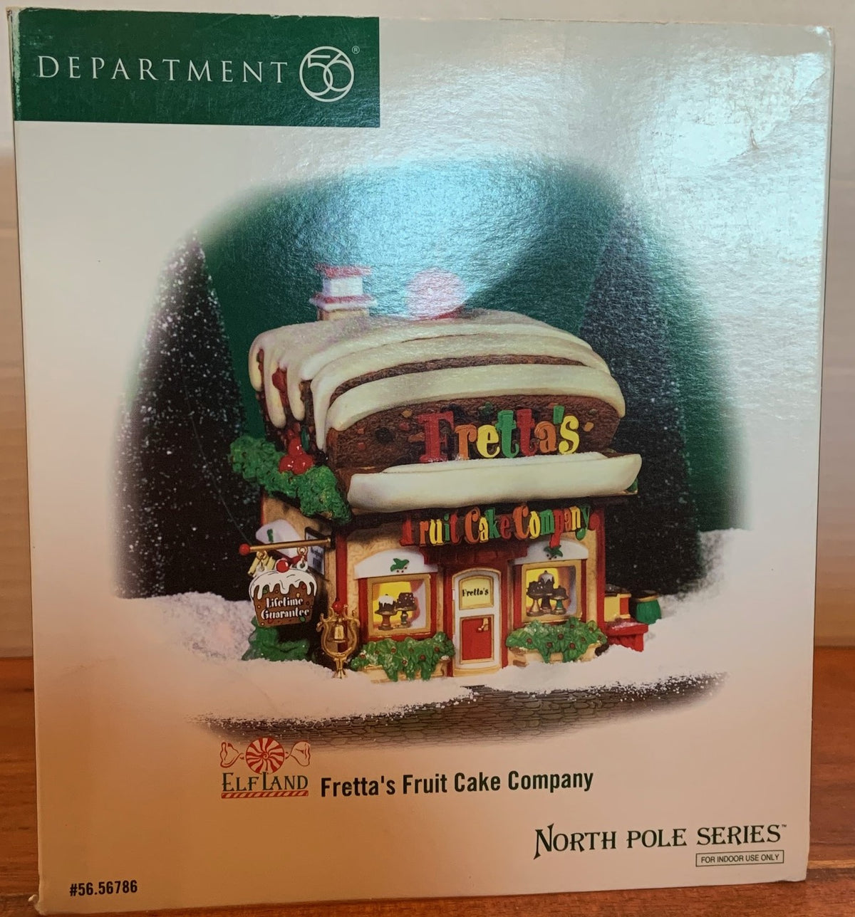 Retired Department 56- North Pole Series   Village "Fretta's Fruit Cake Company