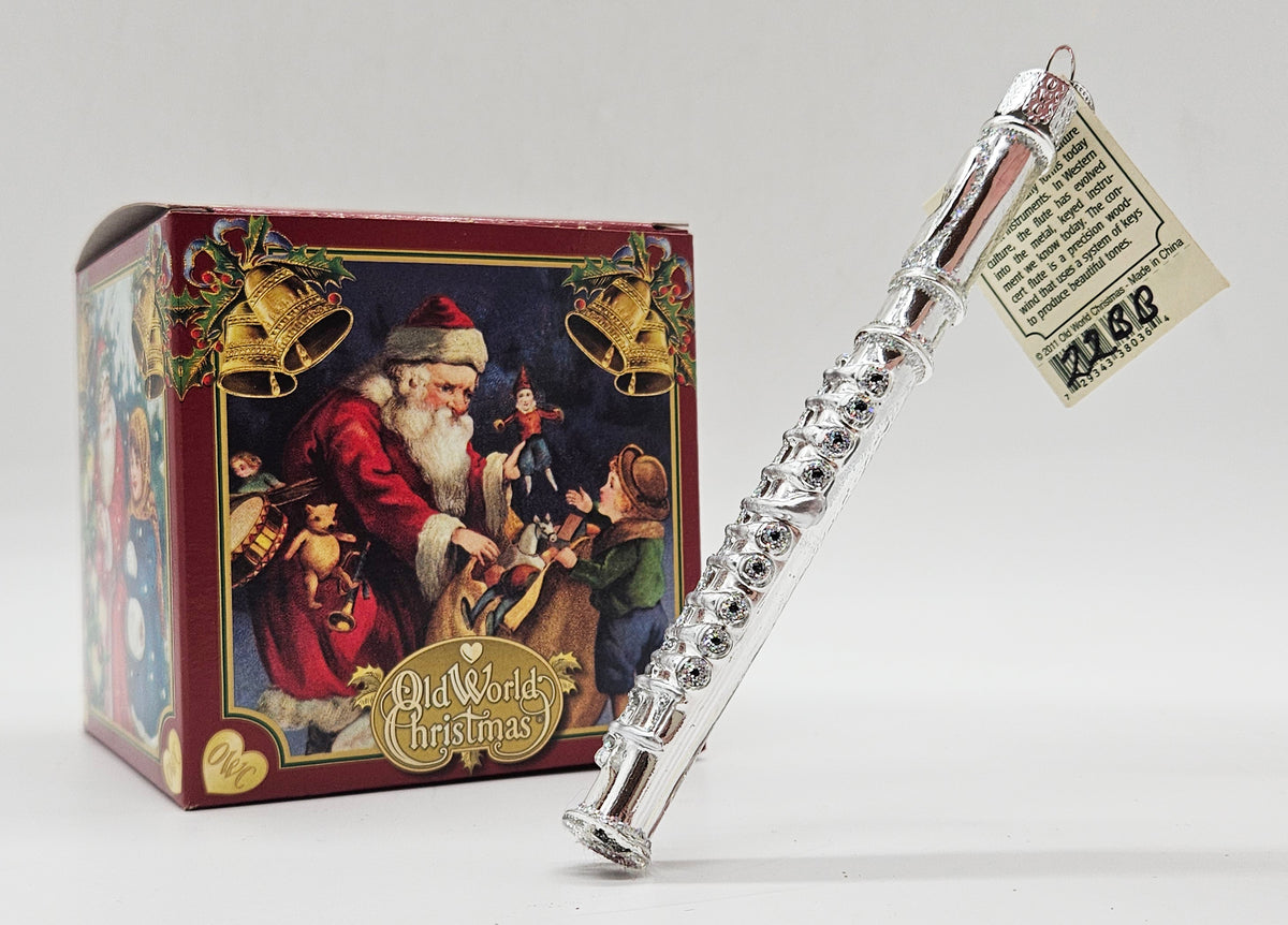 Old World Christmas Flute ornament #38036 – ornament alongside photographed packaging