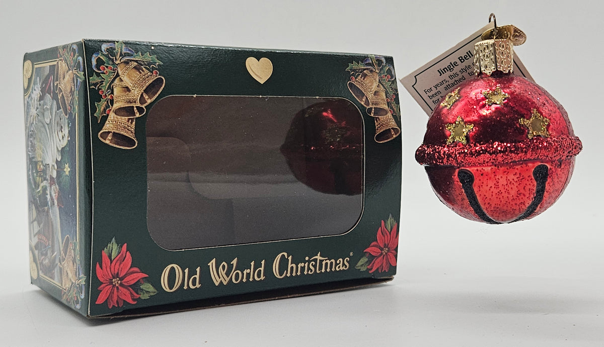 Old World Christmas Jingle Bell – Red ornament #38022 – ornament alongside photographed packaging