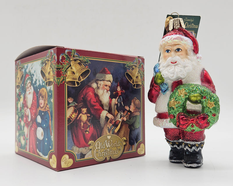 Old World Christmas Santa with Wreath ornament #40279 – ornament alongside photographed packaging