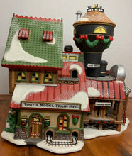 Load image into Gallery viewer, Department 56- North Pole Village &quot;Toot&#39;s Model Train Mfg.&quot; 
