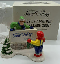 Load image into Gallery viewer, Dept 56- Snow Village "Kids Decorating the Village Sign"
