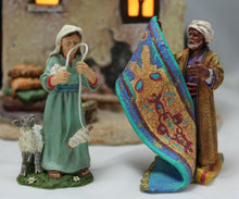 Load image into Gallery viewer, Department 56 Little Town of Bethlehem Rug Merchant&#39;s Colonnade figurine detail

